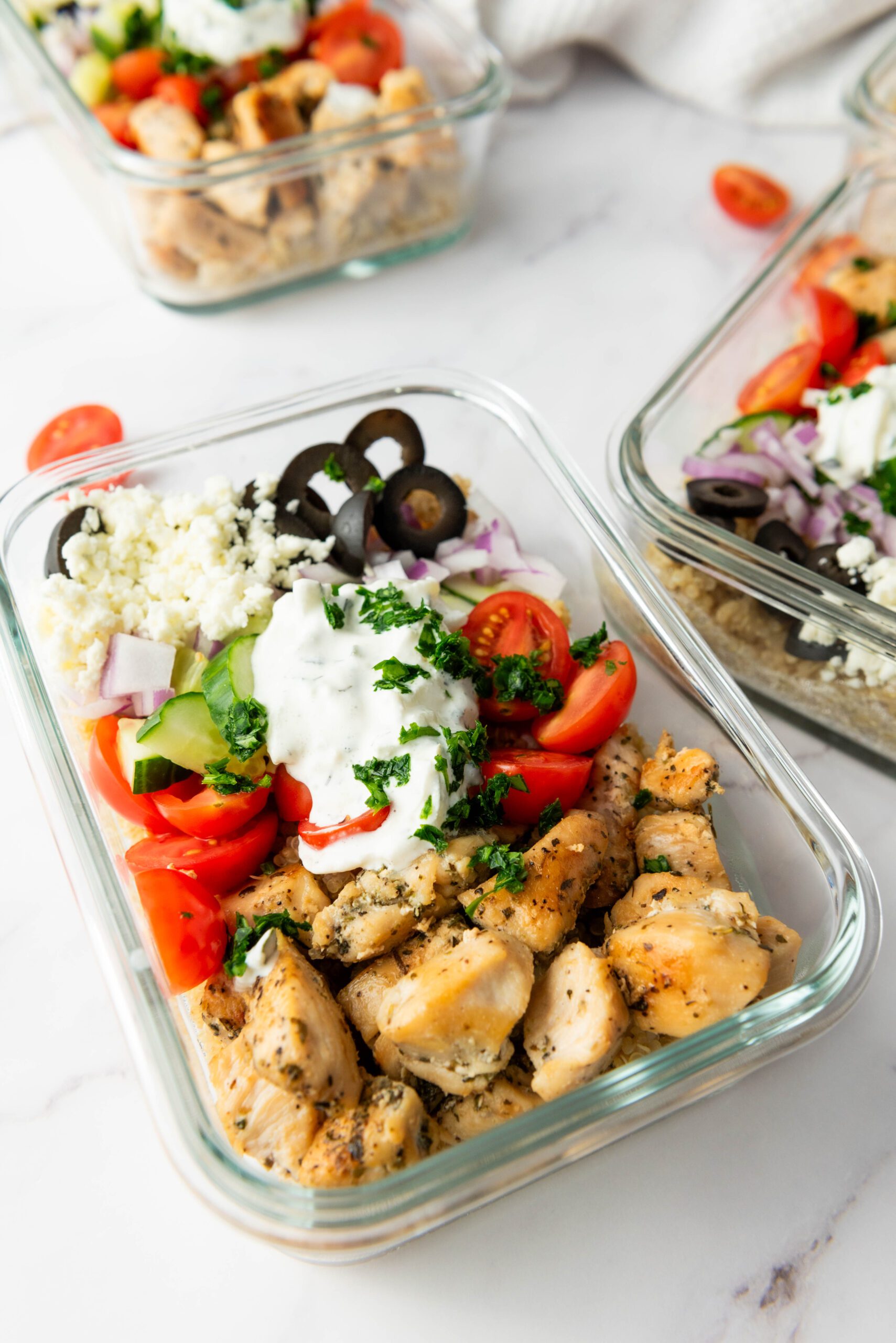 Recipe Card Meal Prep Greek Chicken Quinoa Bowl Servings: 4 Prep Time: 15 minutes Cook Time: 25 minutes Total Time: 40 minutes Ingredients For the Quinoa Base: 1 cup quinoa, rinsed 2 cups water or chicken broth 1/2 teaspoon salt For the Chicken: 1 pound boneless, skinless chicken breasts or thighs 2 tablespoons olive oil 1 teaspoon salt 1/2 teaspoon black pepper 1 teaspoon Italian seasoning For the Toppings: 1 cup cherry tomatoes, halved 1 cucumber, diced 1/4 red onion, thinly sliced 1/2 cup Kalamata olives, sliced 1/3 cup crumbled feta cheese 1/4 cup fresh parsley, chopped 1 cup store-bought tzatziki sauce Instructions Prepare the Quinoa: In a medium pot, bring water or chicken broth to a boil. Add quinoa and salt, reduce heat, cover, and simmer for 15 minutes until tender. Fluff with a fork and set aside. Cook the Chicken: Season chicken with salt, pepper, and Italian seasoning. Heat olive oil in a skillet over medium-high heat and cook chicken for 4-6 minutes per side until golden and cooked through. Rest for 5 minutes, then slice. Assemble the Bowls: Divide quinoa among four bowls. Top with chicken, cherry tomatoes, cucumber, red onion, Kalamata olives, and crumbled feta. Add a dollop of tzatziki and garnish with parsley. Enjoy your flavorful Greek Chicken Quinoa Bowl!